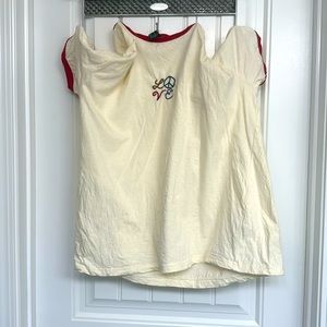 Selling crème love shirt.